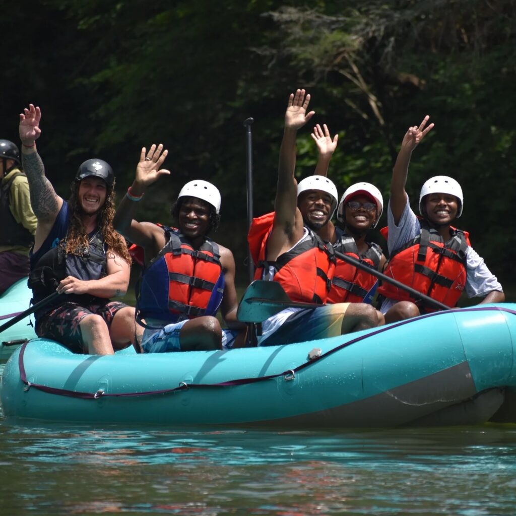 Rafters waving to the camera on the Ocoee River.