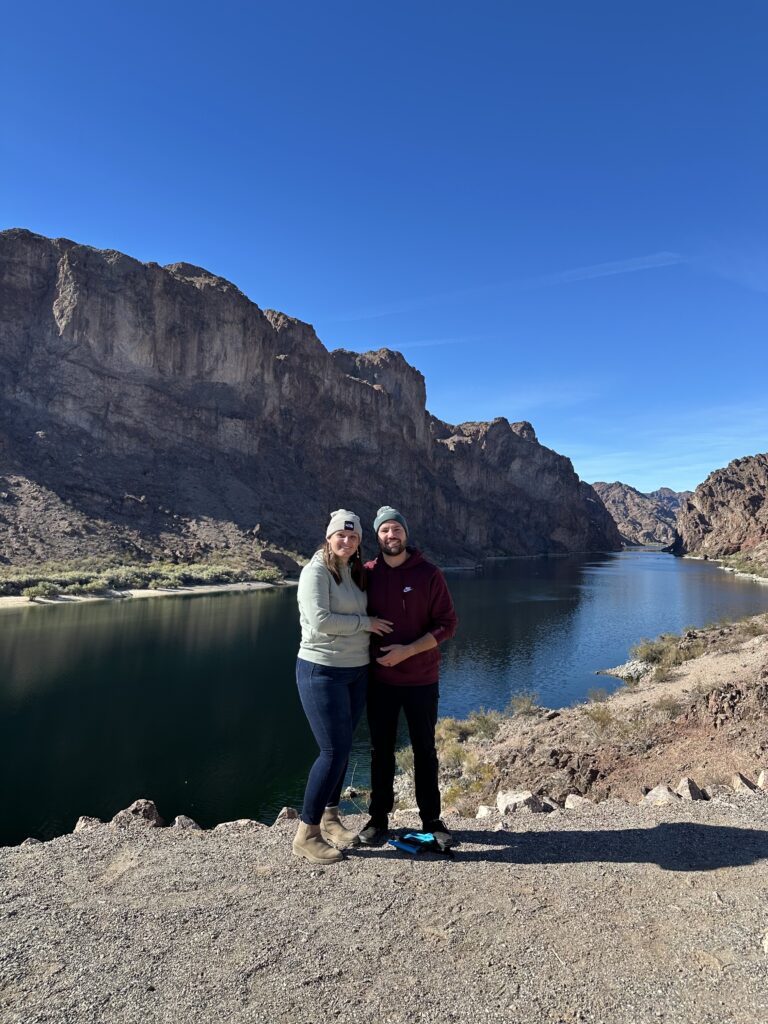 Blazing paddles takes a photo of a happy couple on their trip down the river.