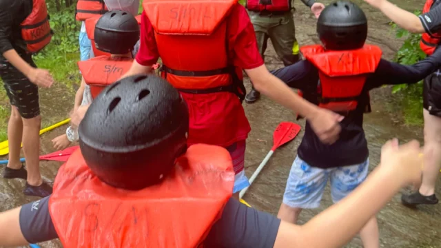 Kosir's Rafting, doing a fun skill test and warmup before the trip.