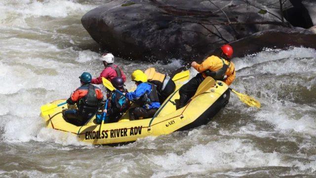 Endless River Adventures group of people riding the rapids.