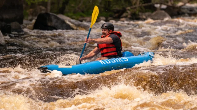 Kosir's Rafting in a ducky on the Peshtigo River.