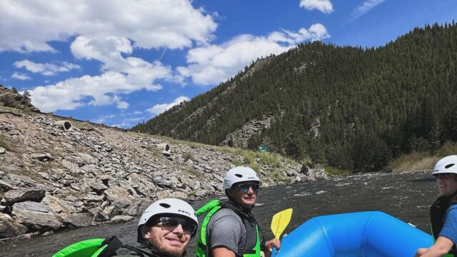 Rafters on Clear Creek with mountains in background.