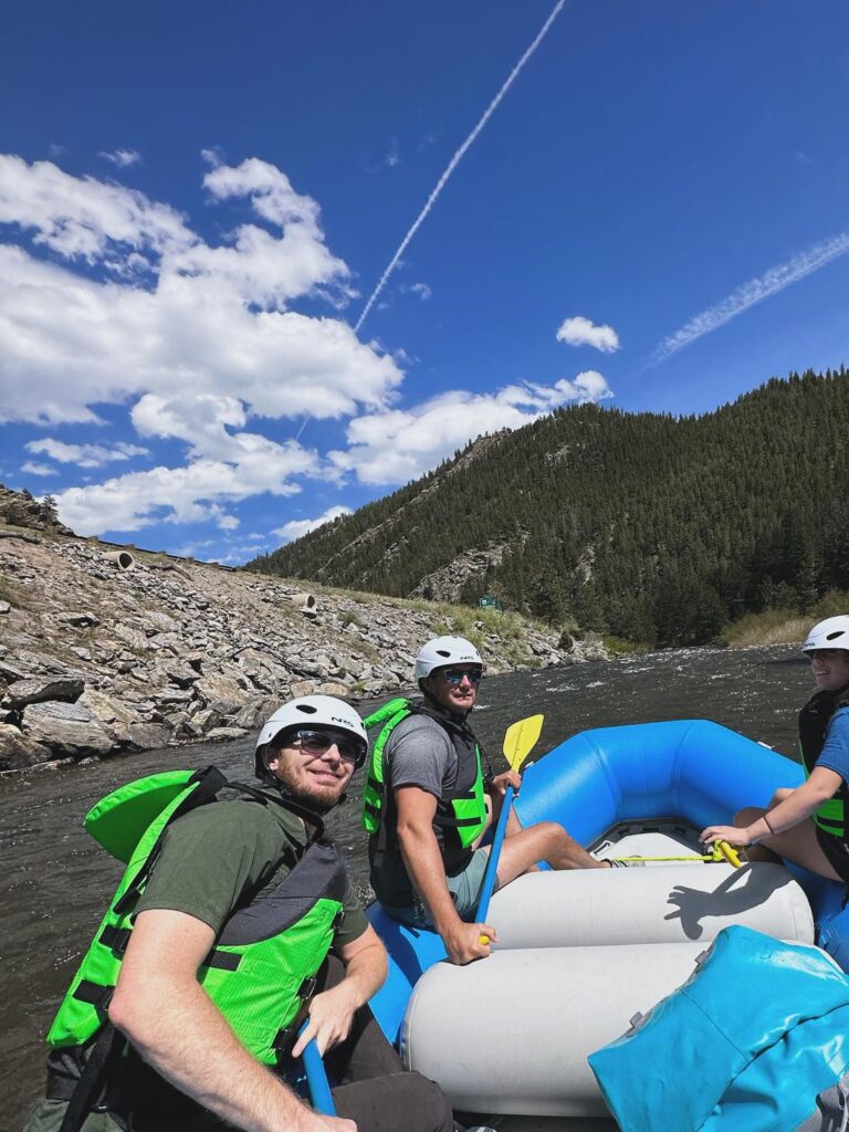 Rafters on Clear Creek with mountains in background.