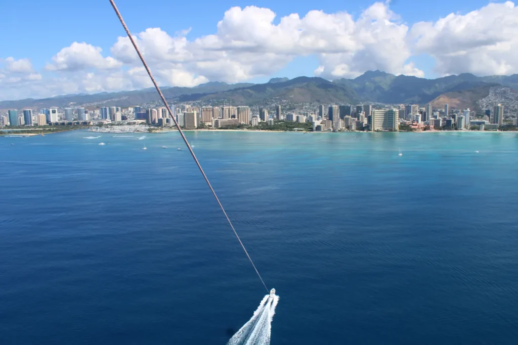 A parasailer's view of Honolulu from the ocean.