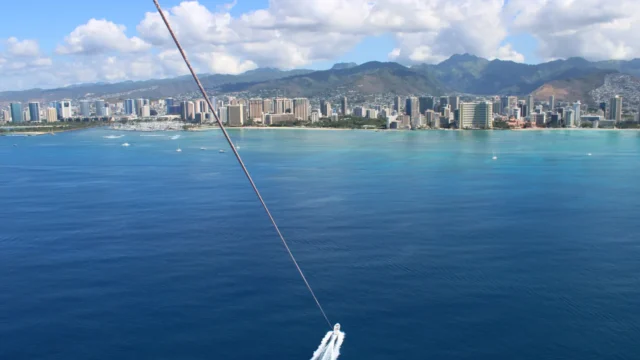 A parasailer's view of Honolulu from the ocean.