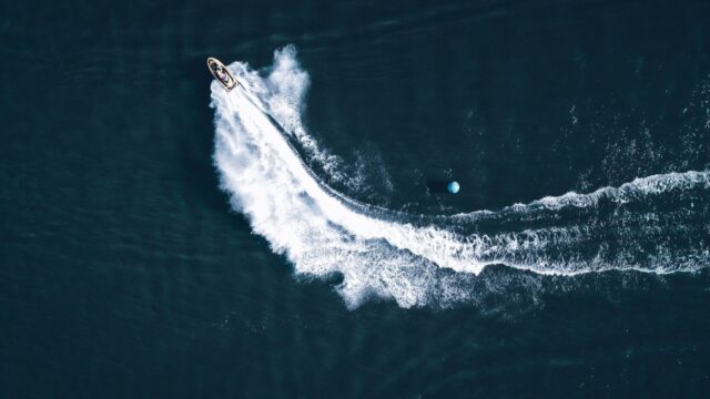 An aerial view of a jet ski speeding on water.