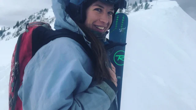 Lynn Barlow on a mountain back country skiing.