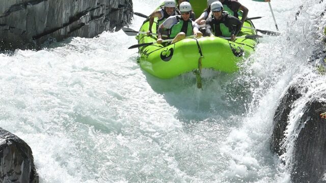 A raft going through Tunnel Chute Rapid on The American River.