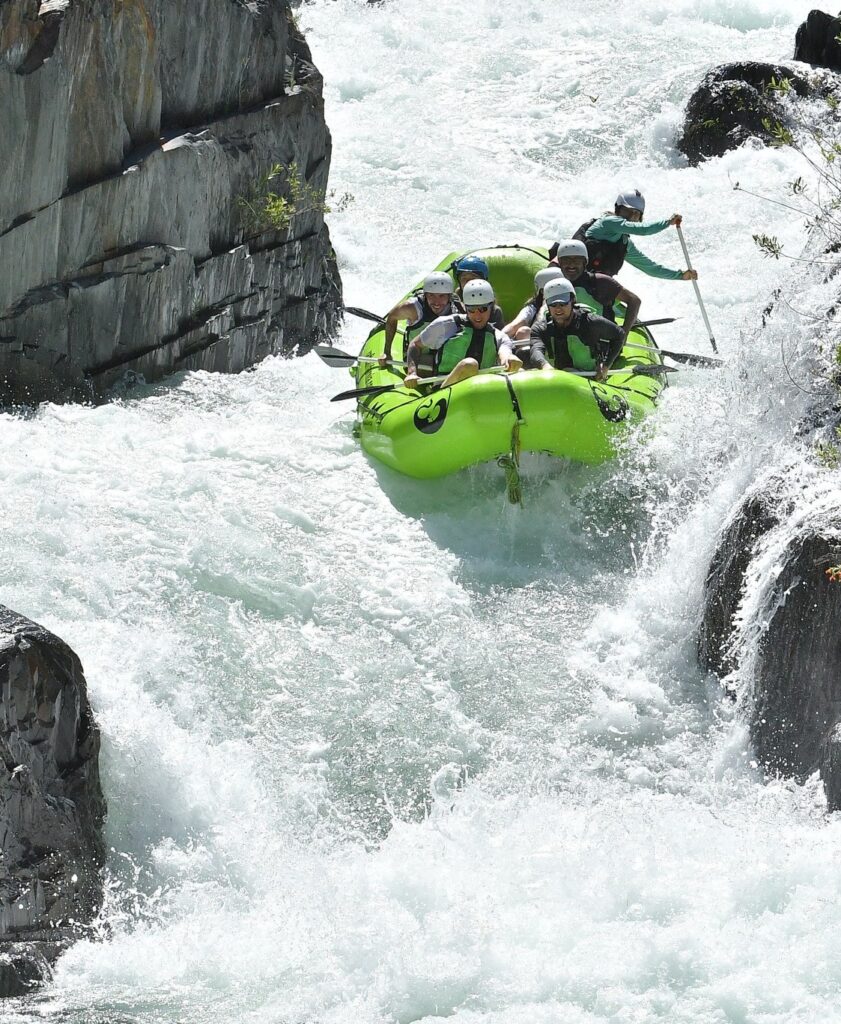 A raft going through Tunnel Chute Rapid on The American River.