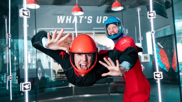 A girl flying in the iFLY tunnel