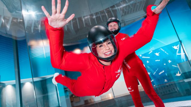 A girl flying in the iFLY tunnel