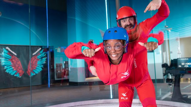 A girl flying in the iFLY tunnel