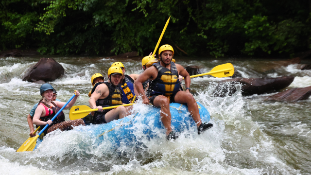 A blue raft full of people.