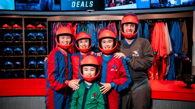 Family in iFly gear happy and ready to go flying