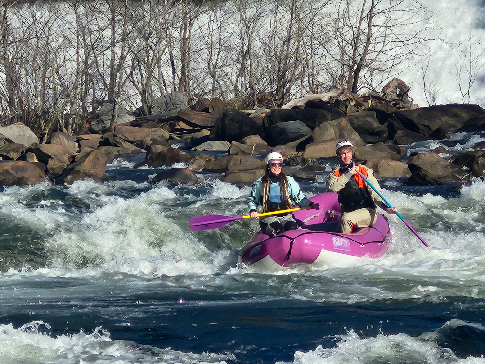 Teo people rafting on the Ocoee with a pink raft