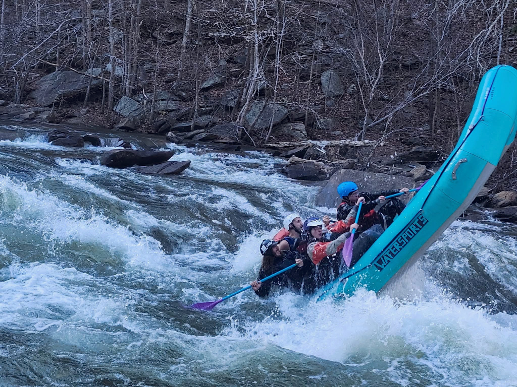 People in a raft backloading to see if they will flip in a rapid on the ocoee river