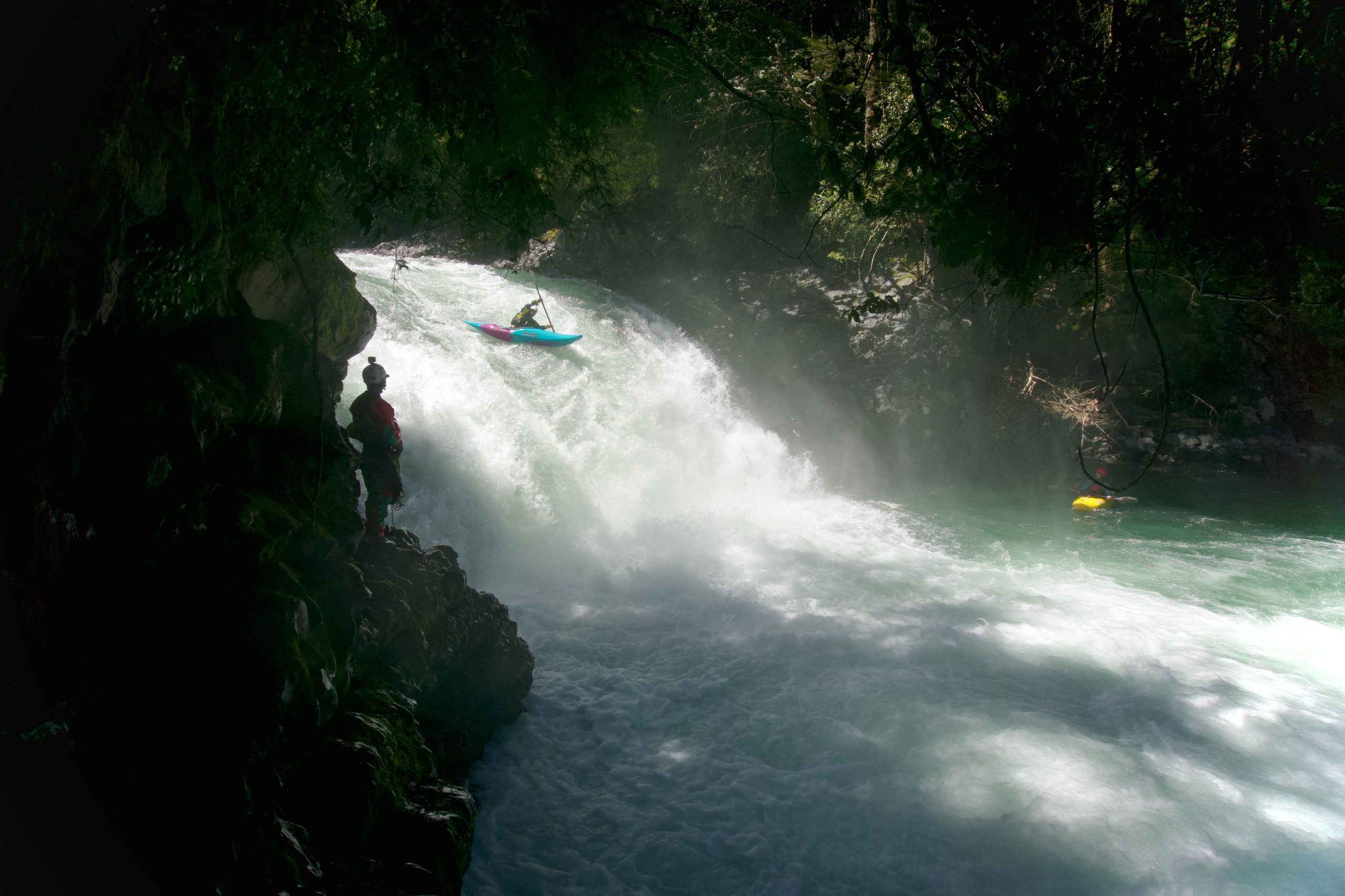 A kayaker running a waterfall in Chile.