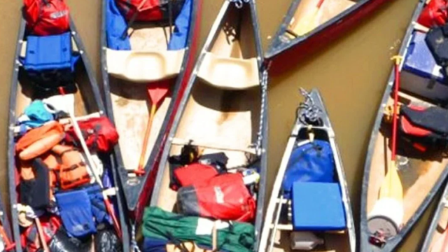 Canoes packed with gear.