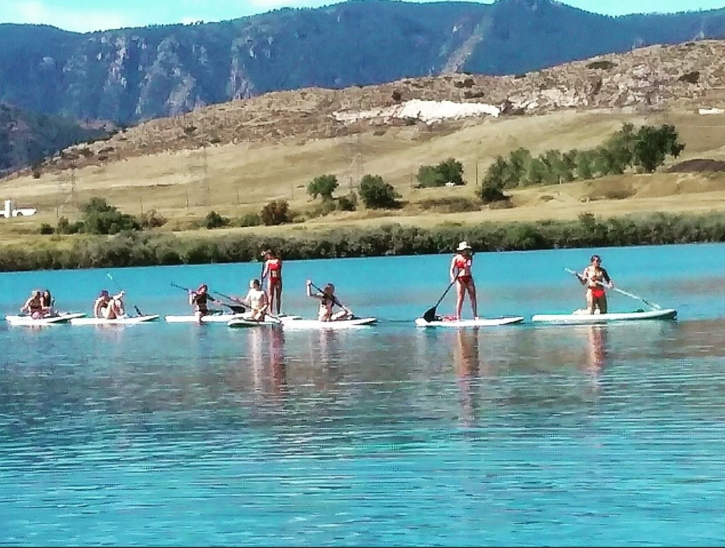 Paddleboarders on a lake in Colorado.