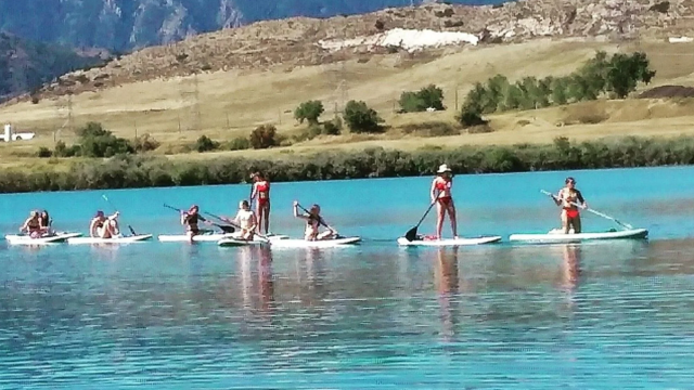 Paddleboarders on a lake in Colorado.