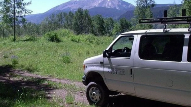 A white van in the mountains.