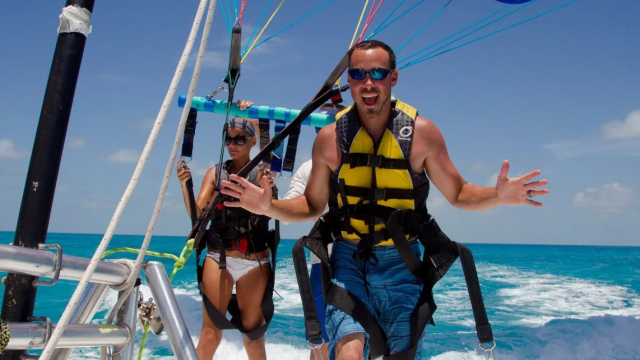 A couple parasailing.