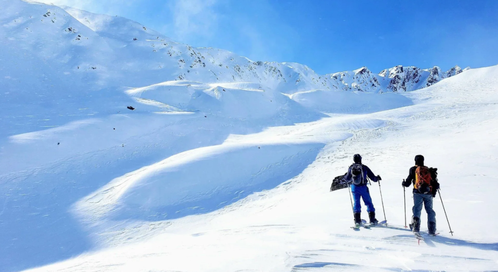 Two skiers on a mountain.
