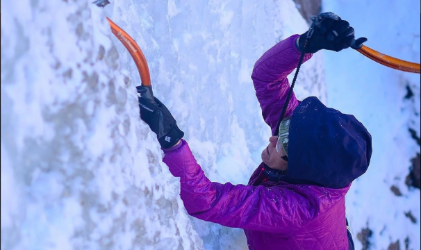 A woman ice climbing in colorado.