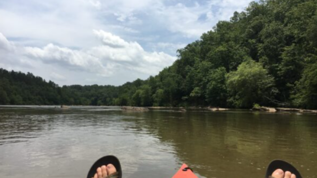 A kayakers feet on Broad River.