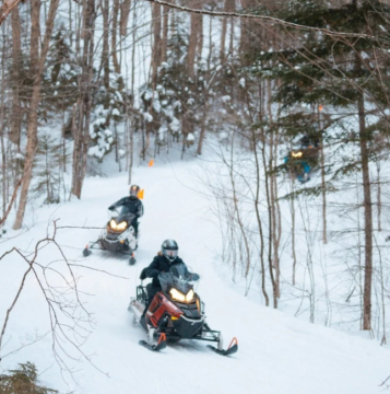Two snowmobilers in vermont.